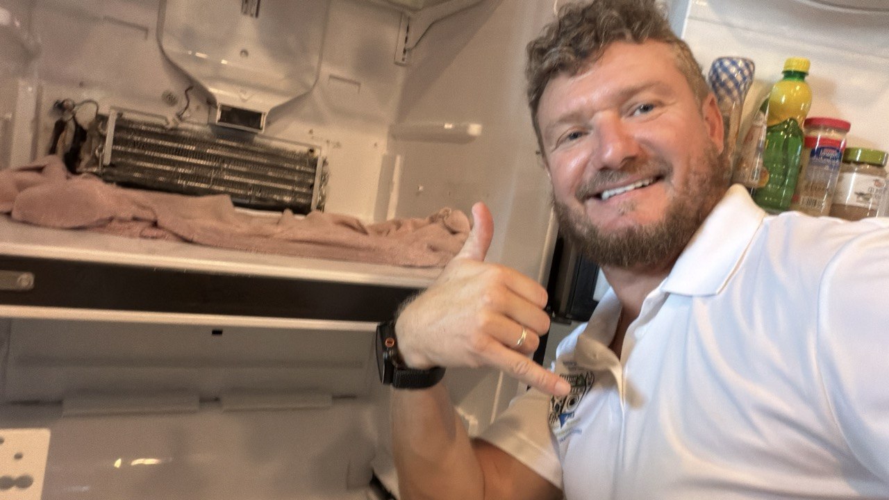 Refrigerator repair in progress in a Naples home