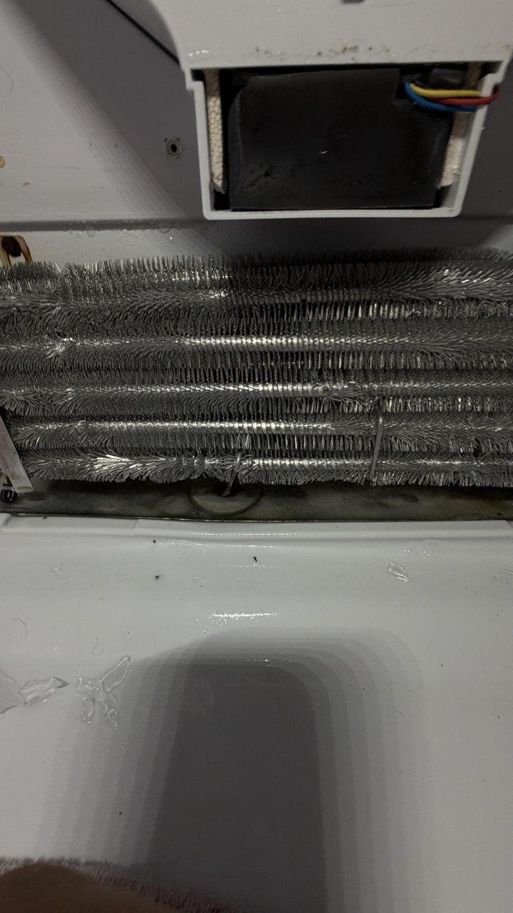 Refrigerator repair in progress in a Naples home