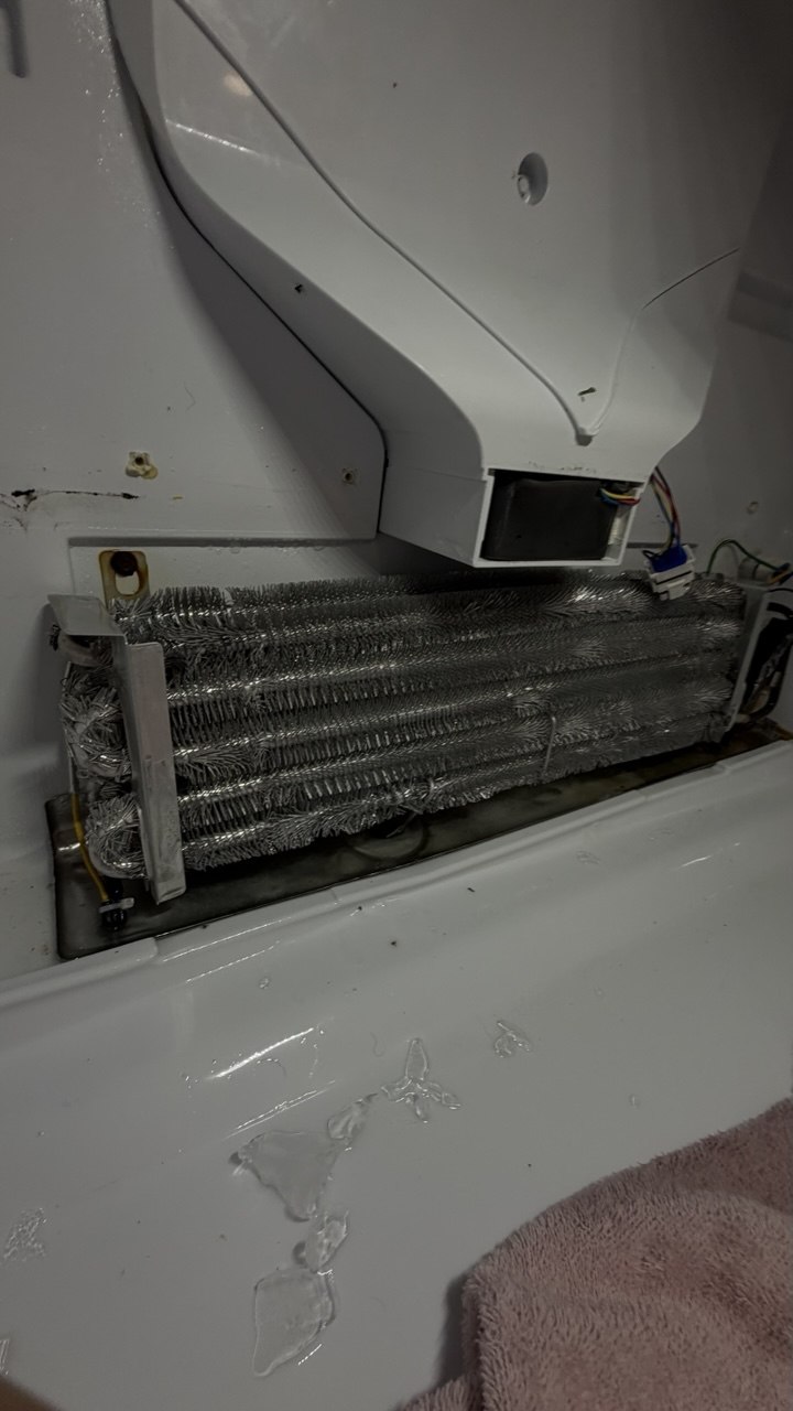 Refrigerator repair in progress in a Naples home