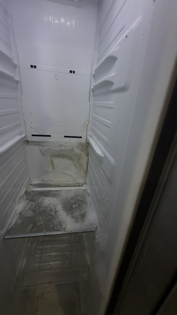Refrigerator repair in progress in a Naples home