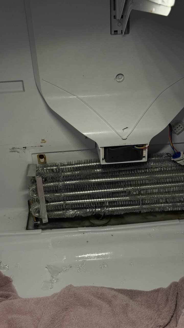 Refrigerator repair in progress in a Naples home