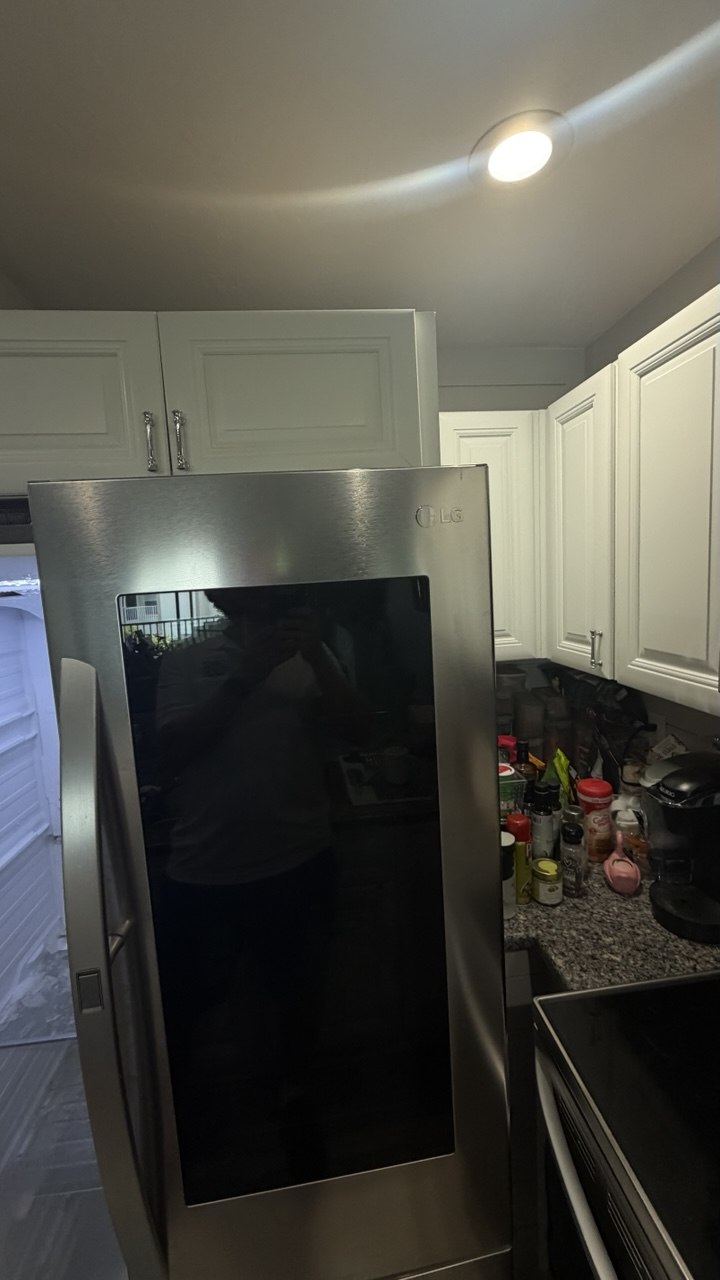 Refrigerator repair in progress in a Naples home