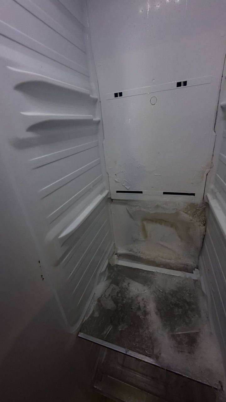 Refrigerator repair in progress in a Naples home