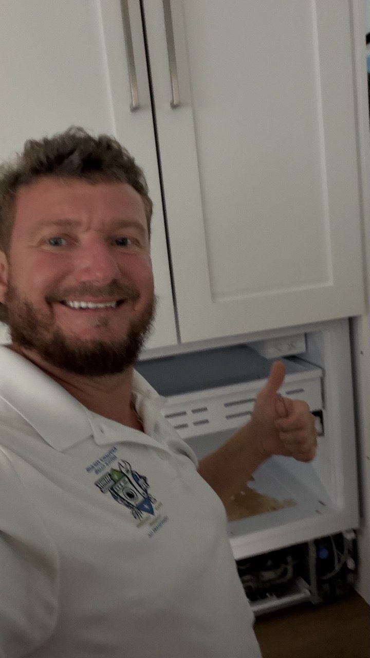 Refrigerator repair in progress in a Naples home