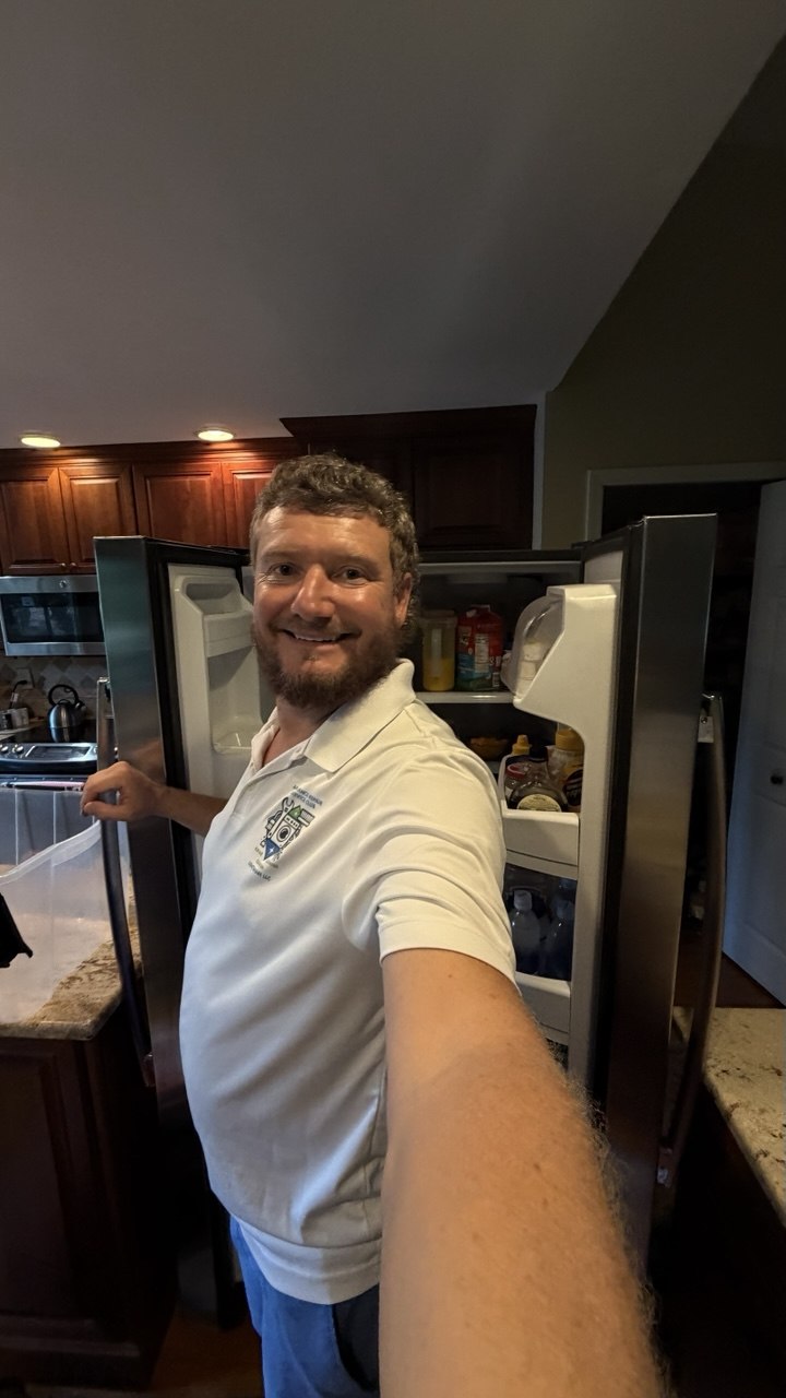 Refrigerator repair in progress in a Naples home